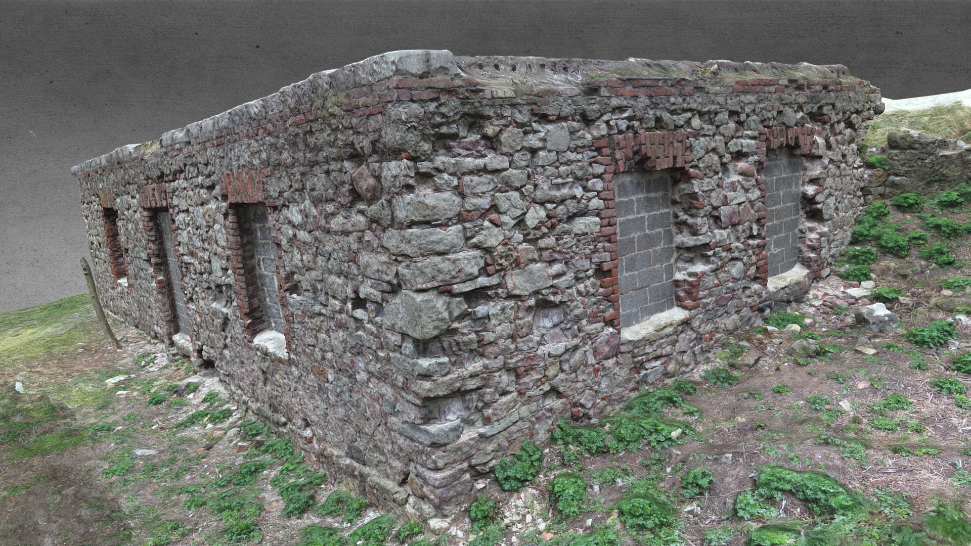 3D model Bunker Ruins in grass - This is a 3D model of the Bunker Ruins in grass. The 3D model is about a stone building with a door.