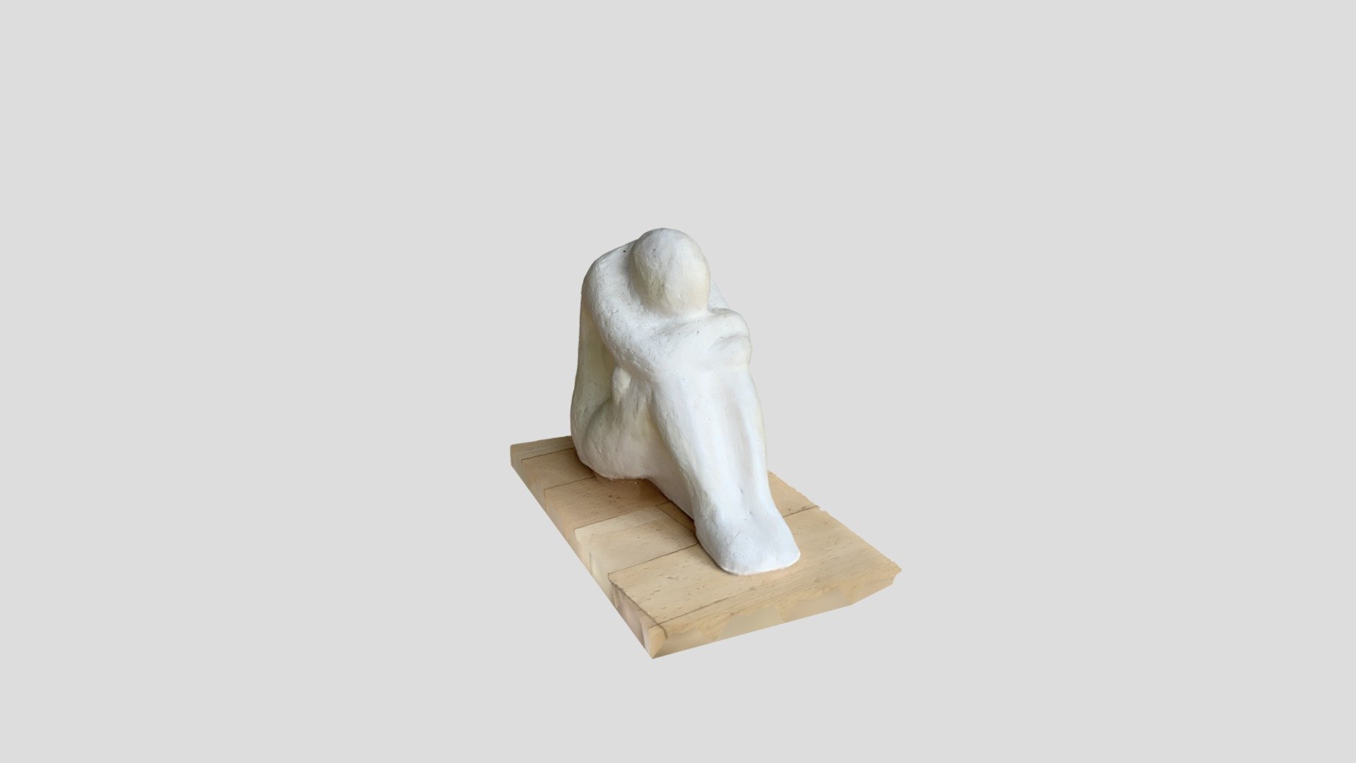 Scuplture of depressed guy