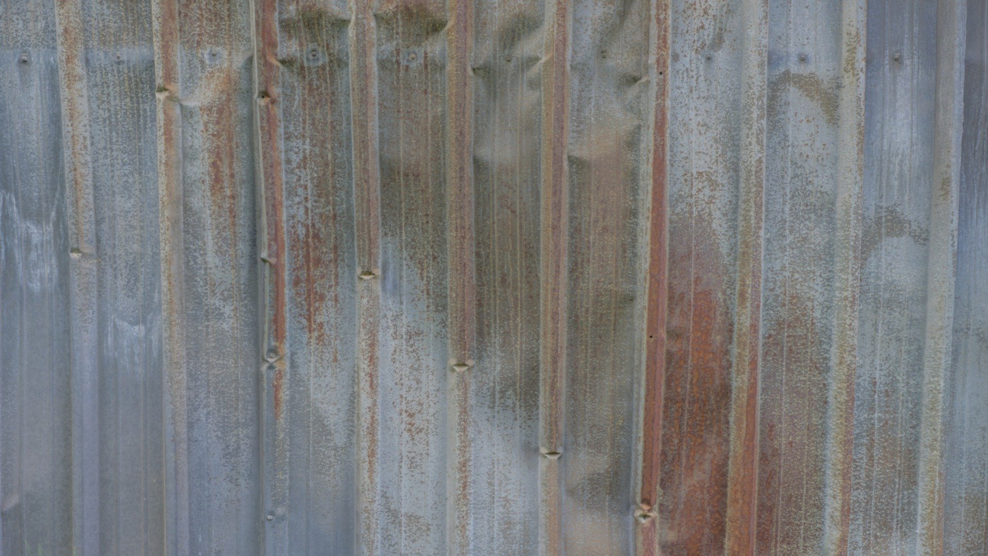 Battered sheet metal wall
