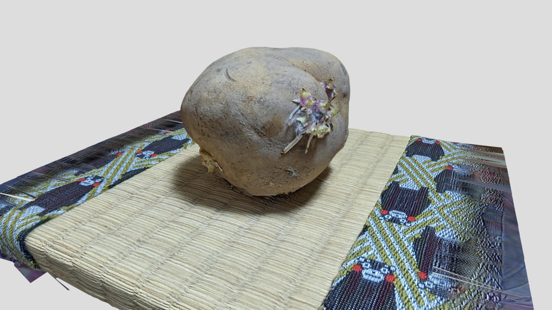 Sprouted potato on tatami