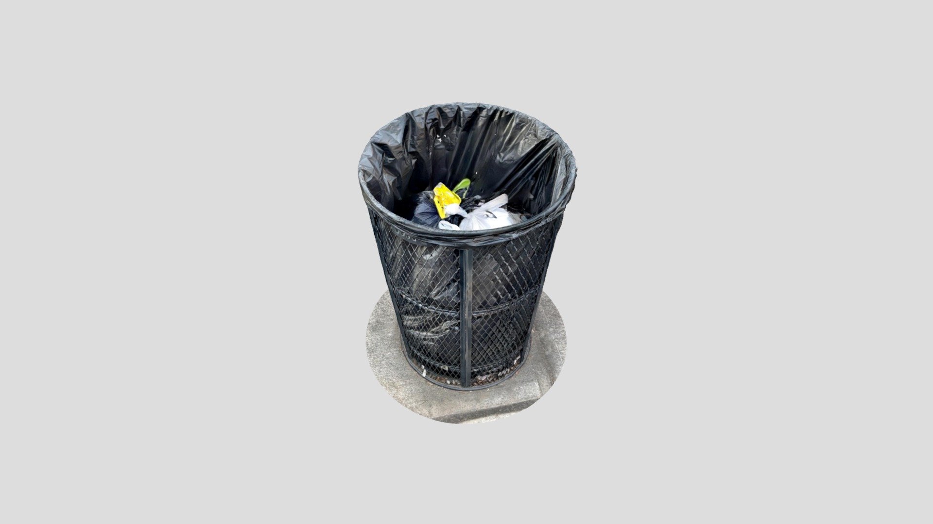half full green wired trash can