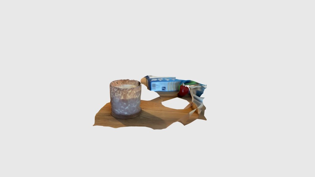 Glasduftkerze auf Holztisch