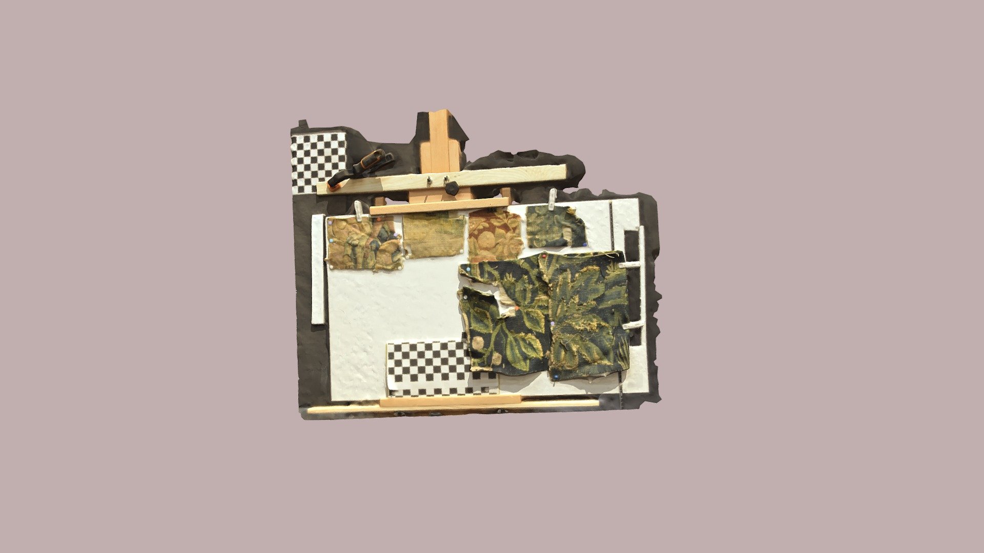 Tapestry fragments on easel