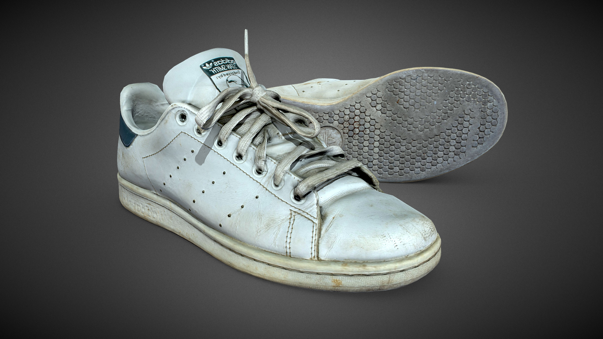 3D model Full old Adidas Stan Smith ( damaged ) - This is a 3D model of the Full old Adidas Stan Smith ( damaged ). The 3D model is about a silver and gold fish.