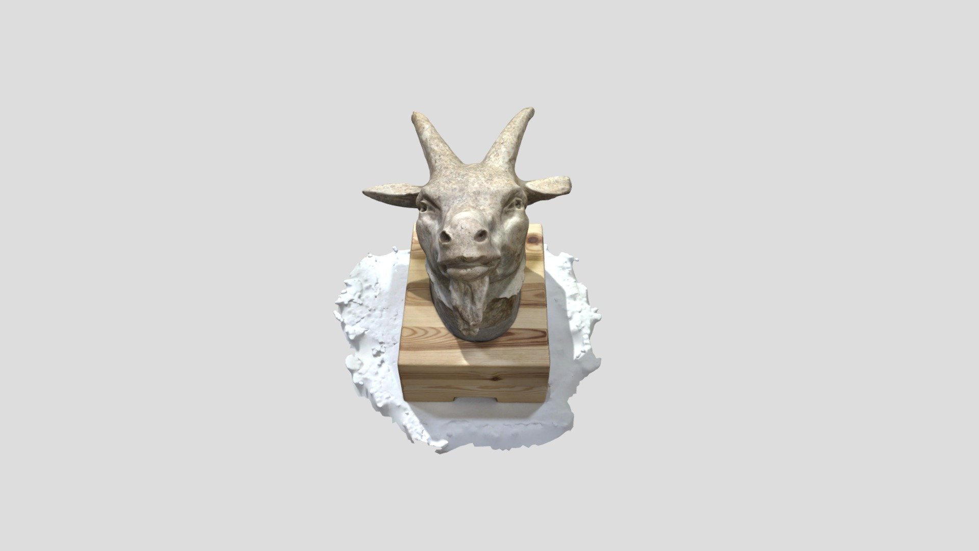 Escultura de cap de boc