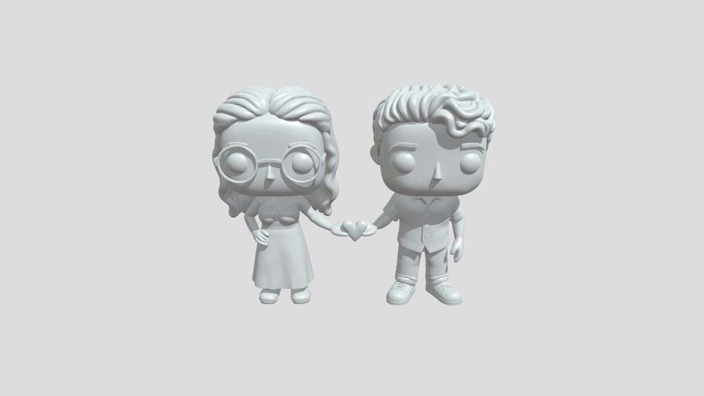 Funko pop couple holding heart