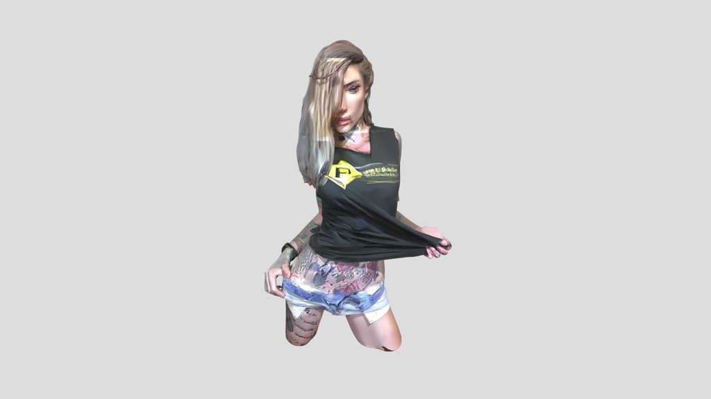 Tattooed woman posing in shorts