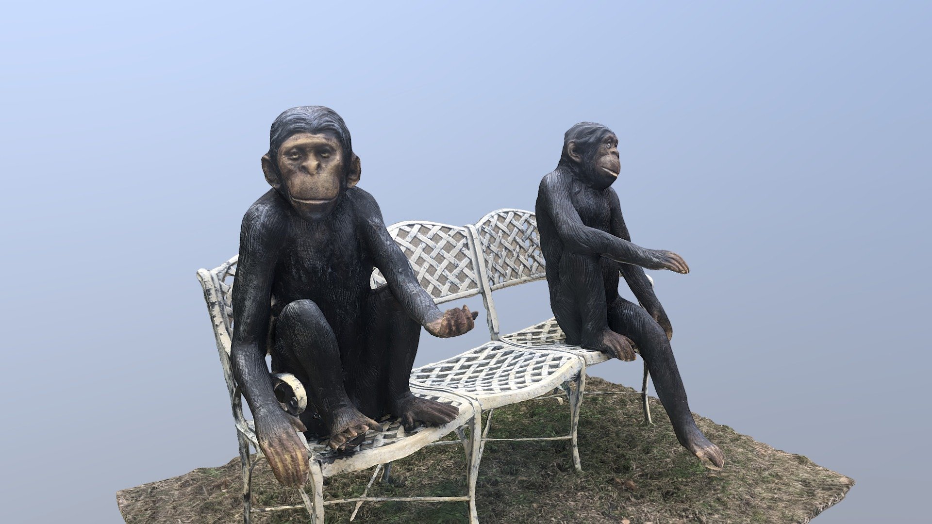 Two Chimpanzees sitting on a bench
