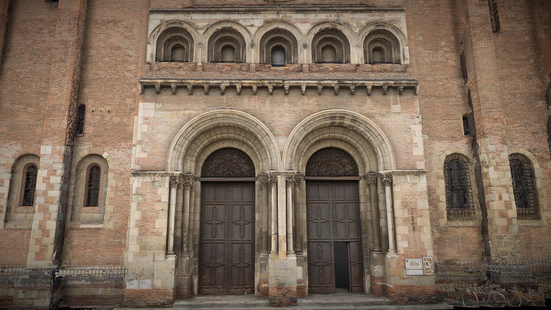 3D model Saint Sernin – Portada occidental - This is a 3D model of the Saint Sernin - Portada occidental. The 3D model is about a brick building with arched doorways.