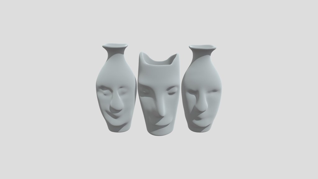 Trio Of Sculpted Faces