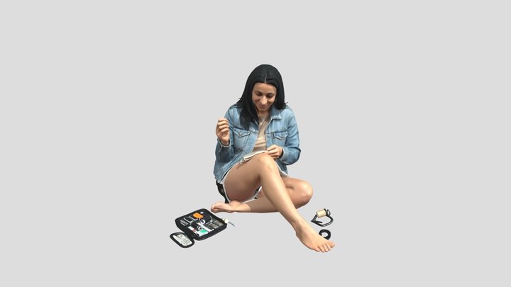 Woman Sewing on the Floor
