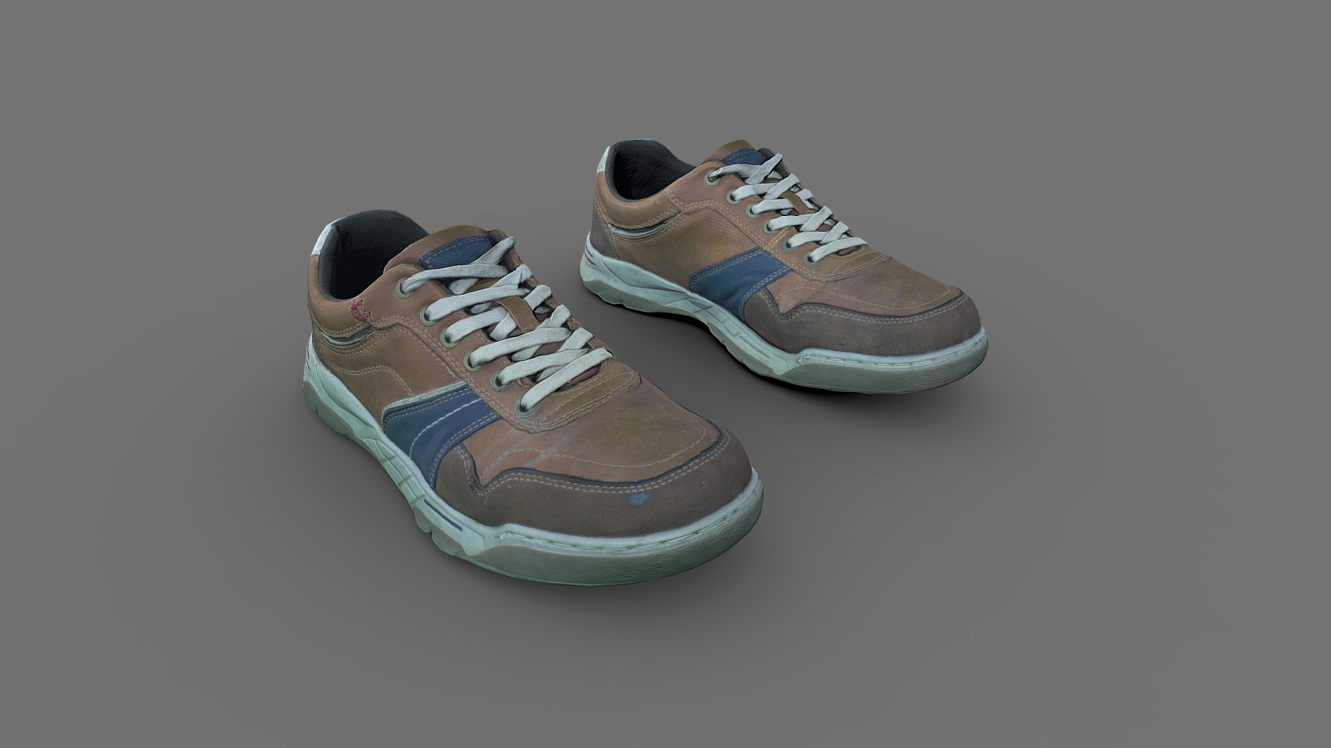 3D model Pair of Sneakers - This is a 3D model of the Pair of Sneakers. The 3D model is about a pair of brown shoes.