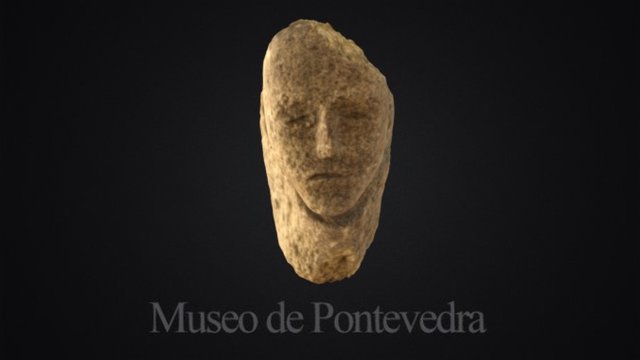 Cabeza de granito de procedencia descoñecida