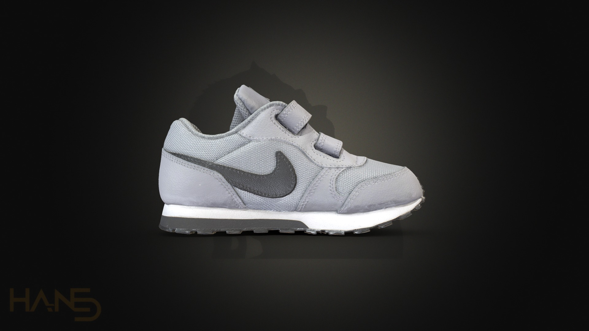 3D model Nike Kids - This is a 3D model of the Nike Kids. The 3D model is about a grey and white shoe.