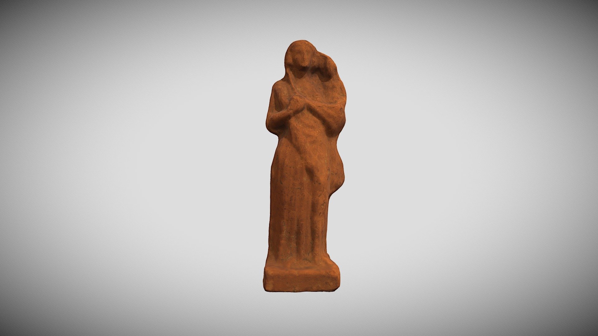 Woman with child figurine