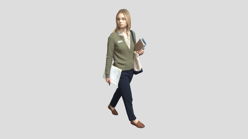 Young Teacher Walking With Notebooks