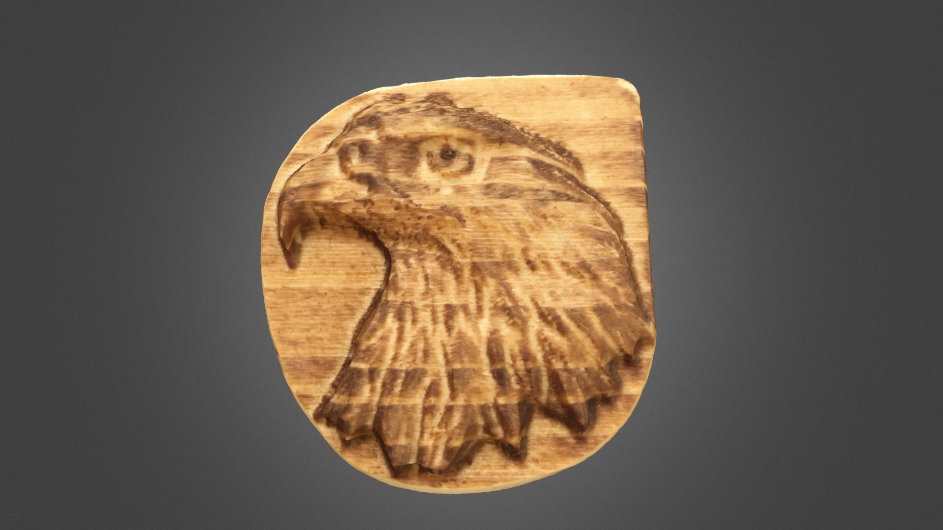 3D model Eagle Keychain /21design - This is a 3D model of the Eagle Keychain /21design. The 3D model is about a wood carving of a face.