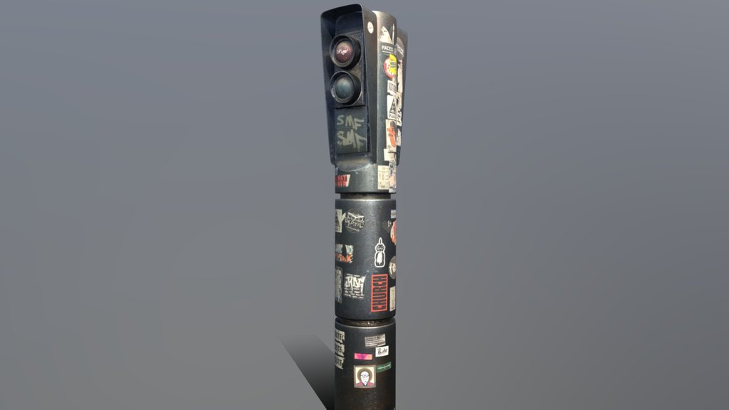 Small traffic light covered in stickers