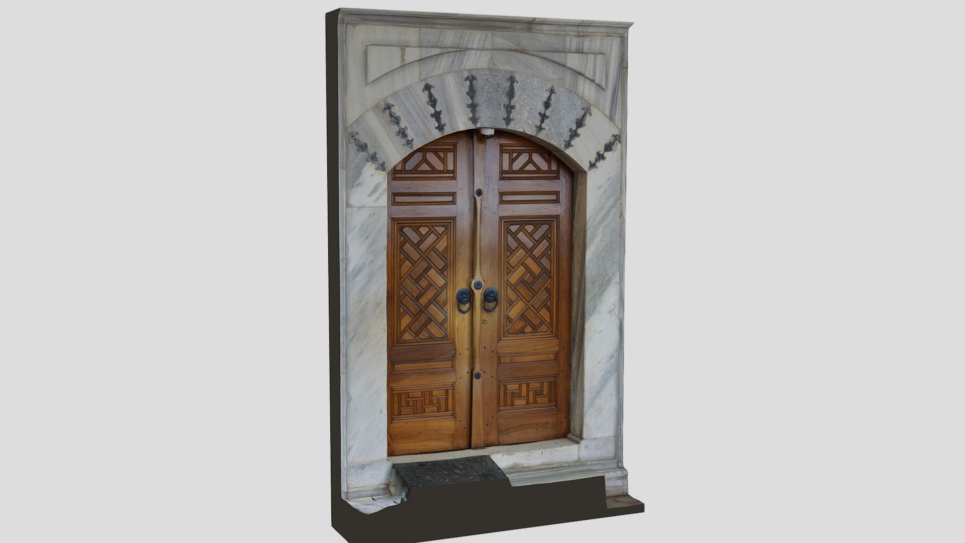 Wooden door with marble frame.