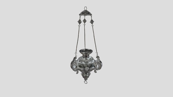 Ornate hanging silver oil lamp