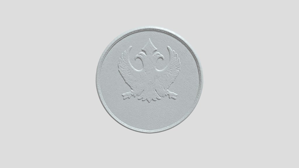Embroidered circular patch with gold bird emble