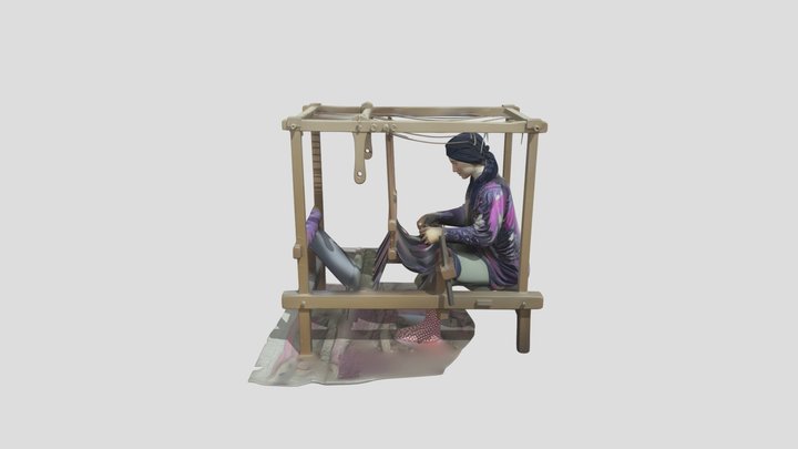 Lady sitting at sock knitting machine