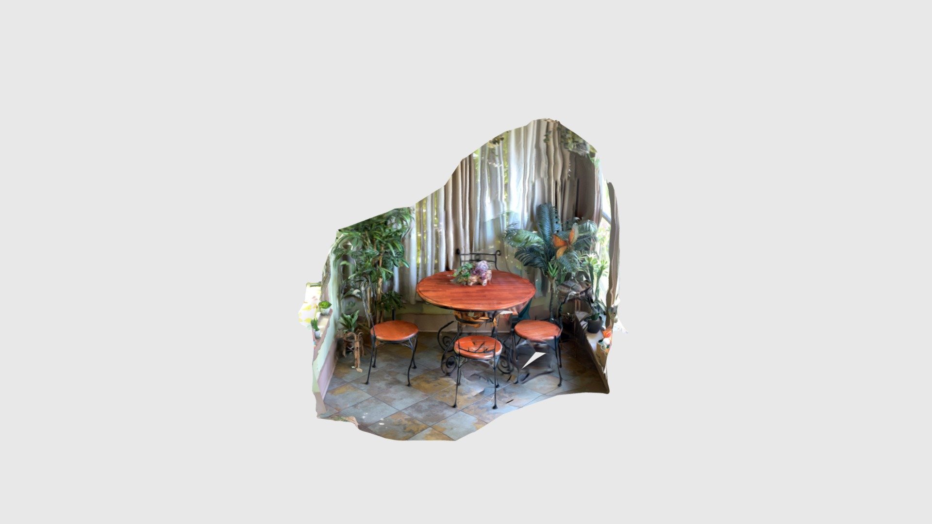Area with table and plants