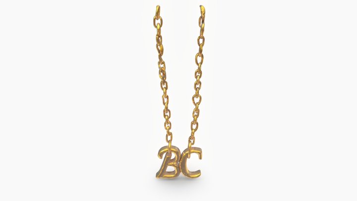 a golden chain that has letters that say 'BC'