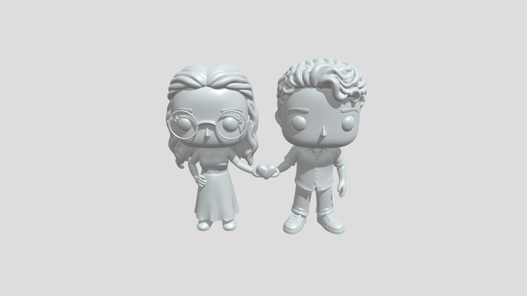 Two Funko couple figures holding heart