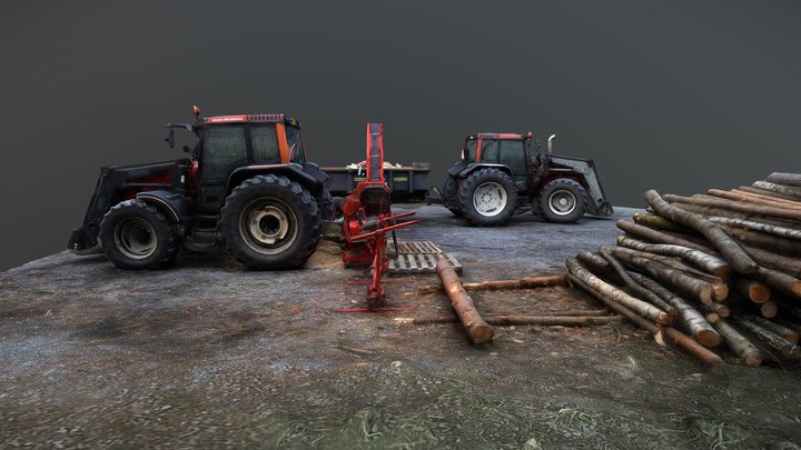 Two tractors with a splitting machine