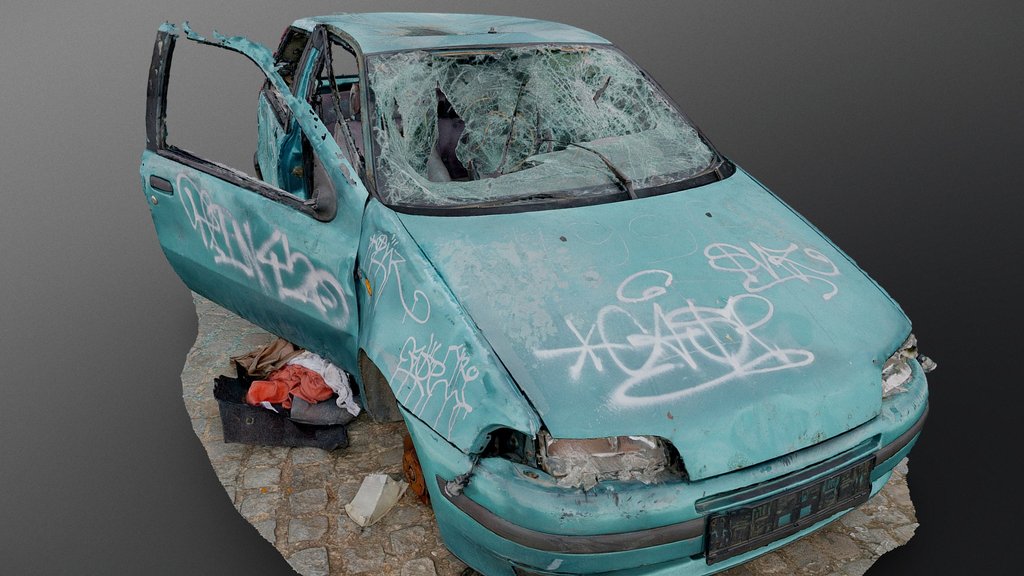 Derelict green car wreck re