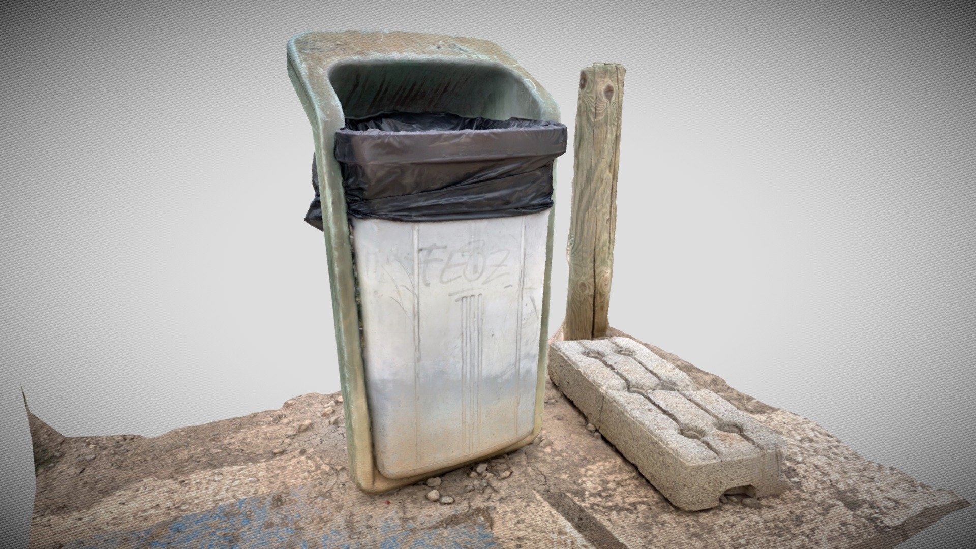 Dirty and dusty old street trash can + brick