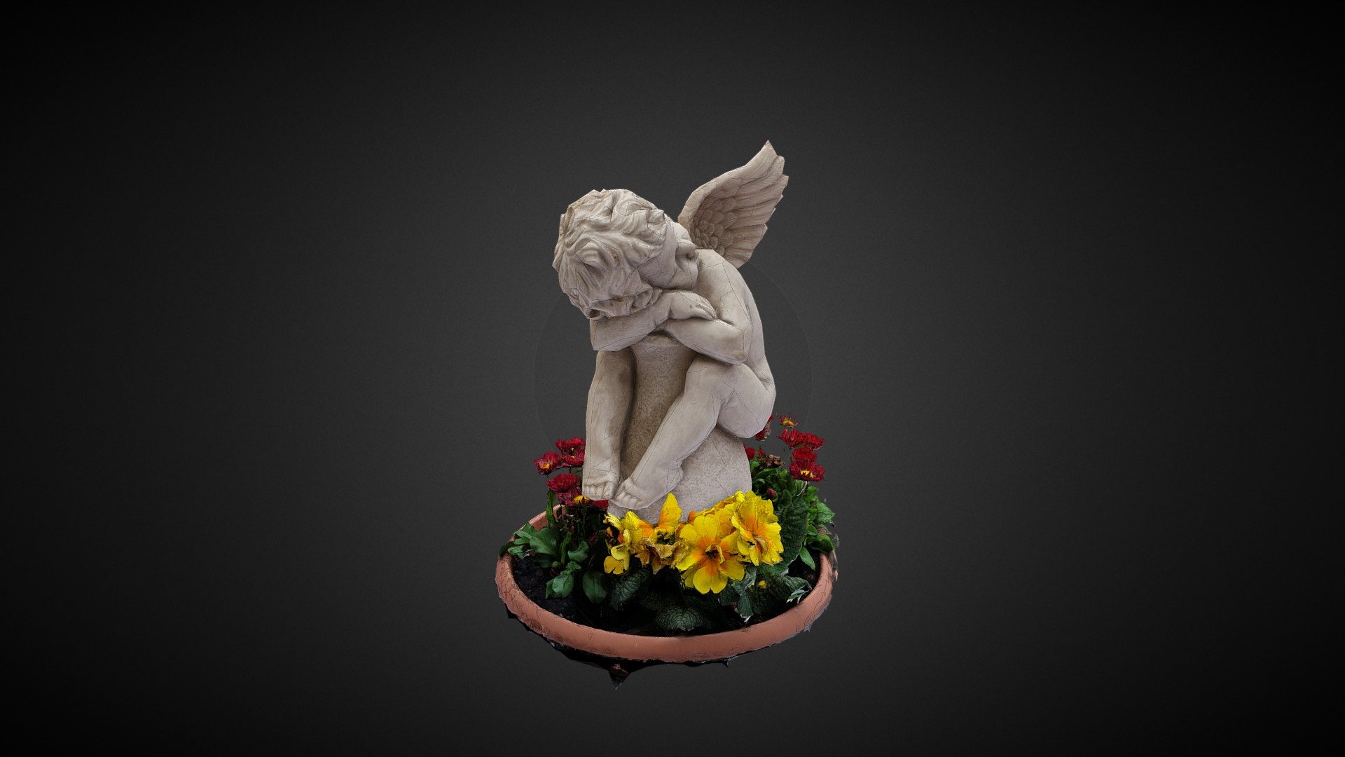 Angel relaxes in flowers