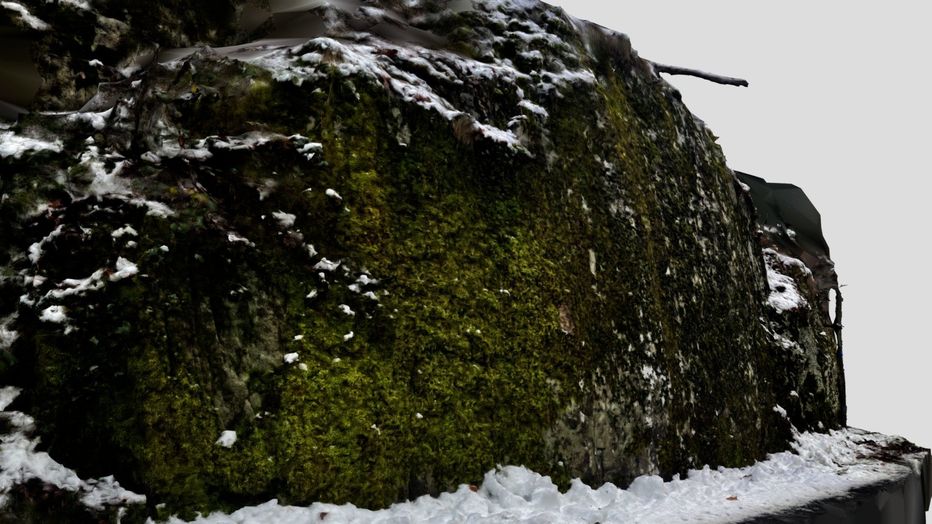 Big rock near the snowy road