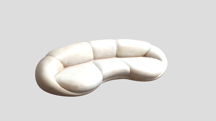 A modern rounded cream-colored sofa