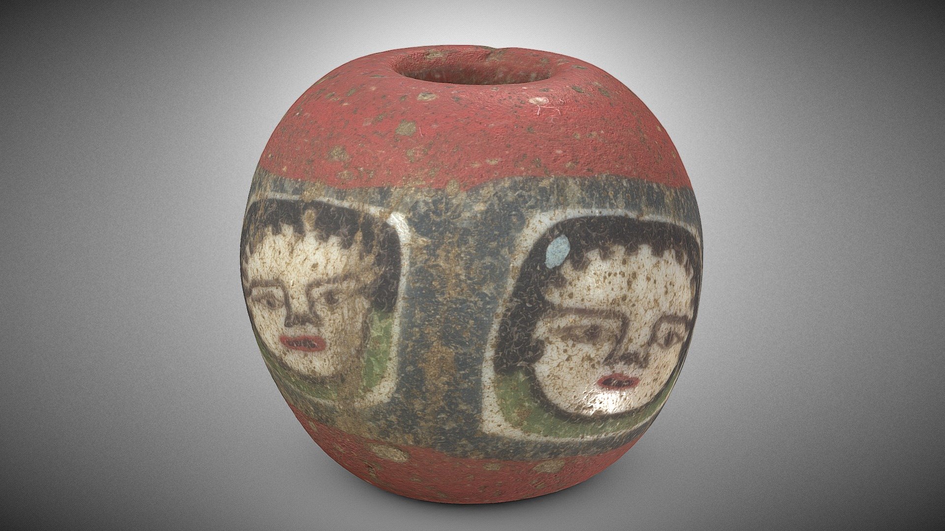 Glass bead with faces