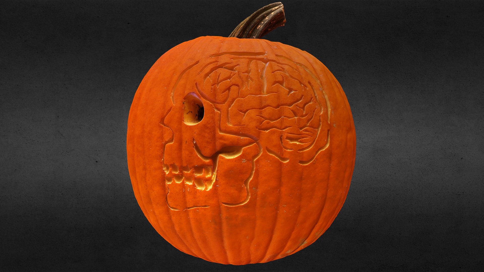 3D model Brain and Skull Jack-o-lantern - This is a 3D model of the Brain and Skull Jack-o-lantern. The 3D model is about a carved pumpkin with a face.
