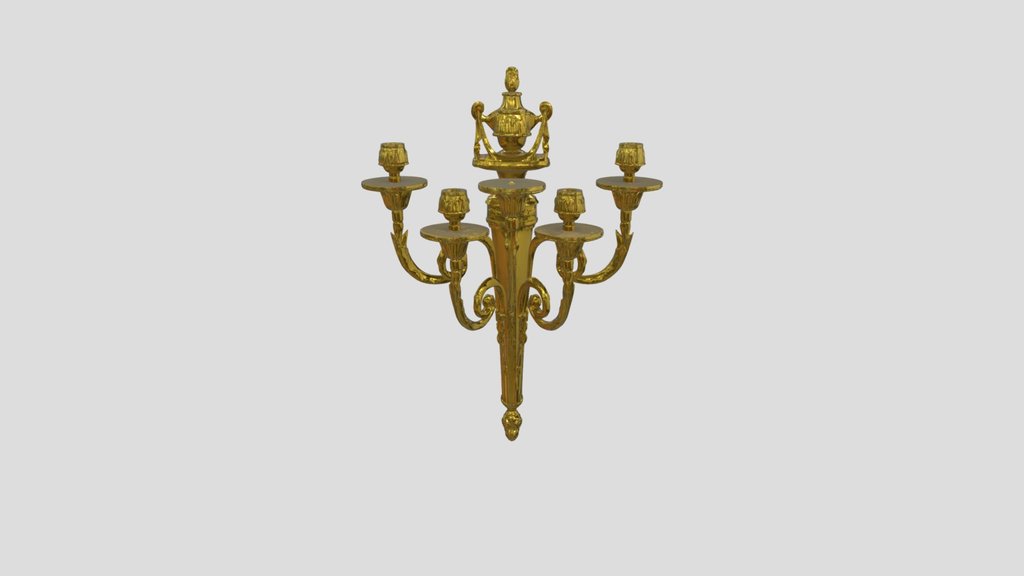Golden wall-mounted candle sconce