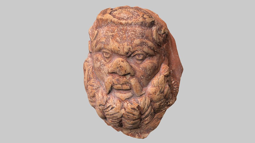 Appliqué in the form of a head of Silen
