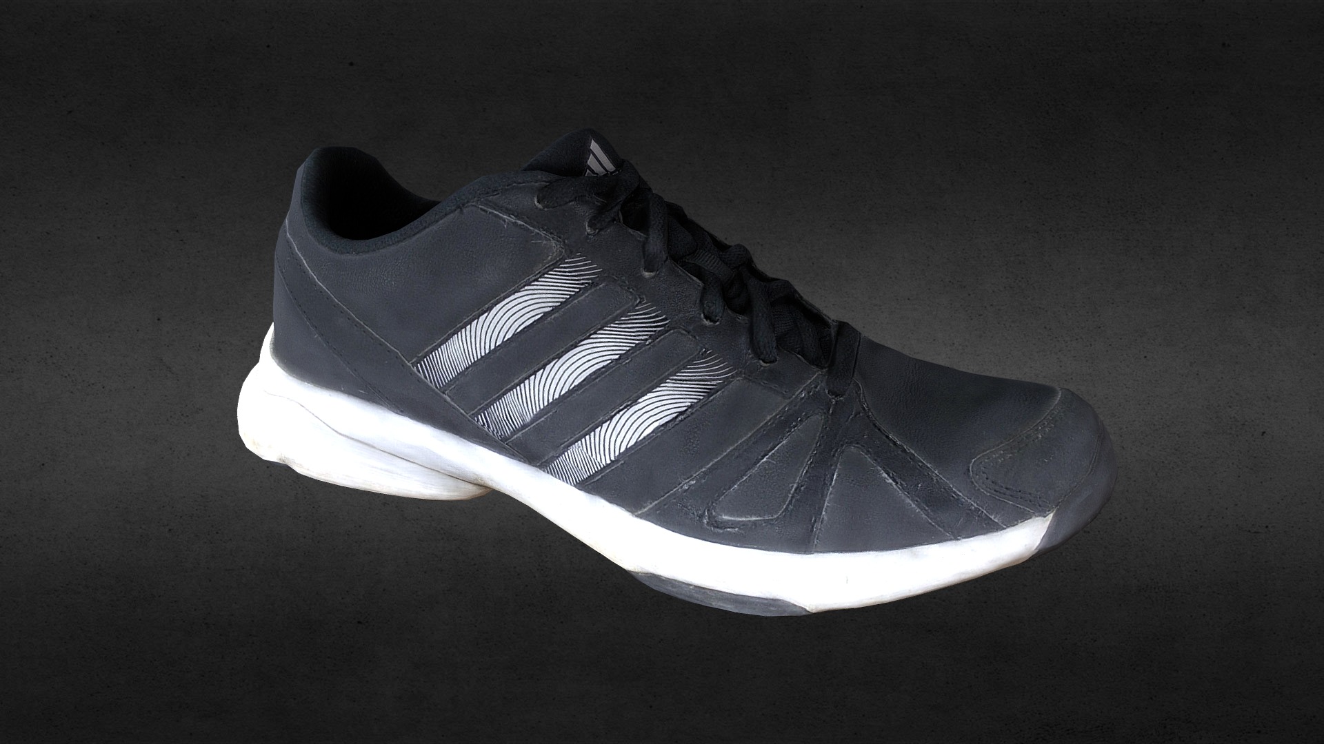 3D model Sneaker low poly - This is a 3D model of the Sneaker low poly. The 3D model is about a black and white shoe.