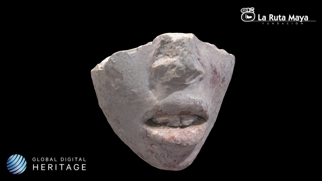 Fragment of anthropomorphic face in stucco