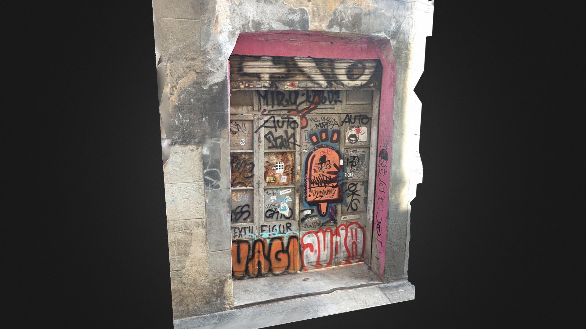 Graffited old door in Gràcia. Barcelona