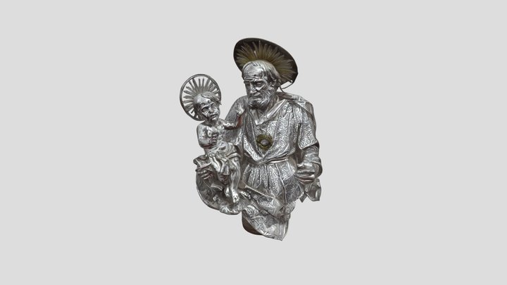 Ornate religious sculpture of saint holding chi