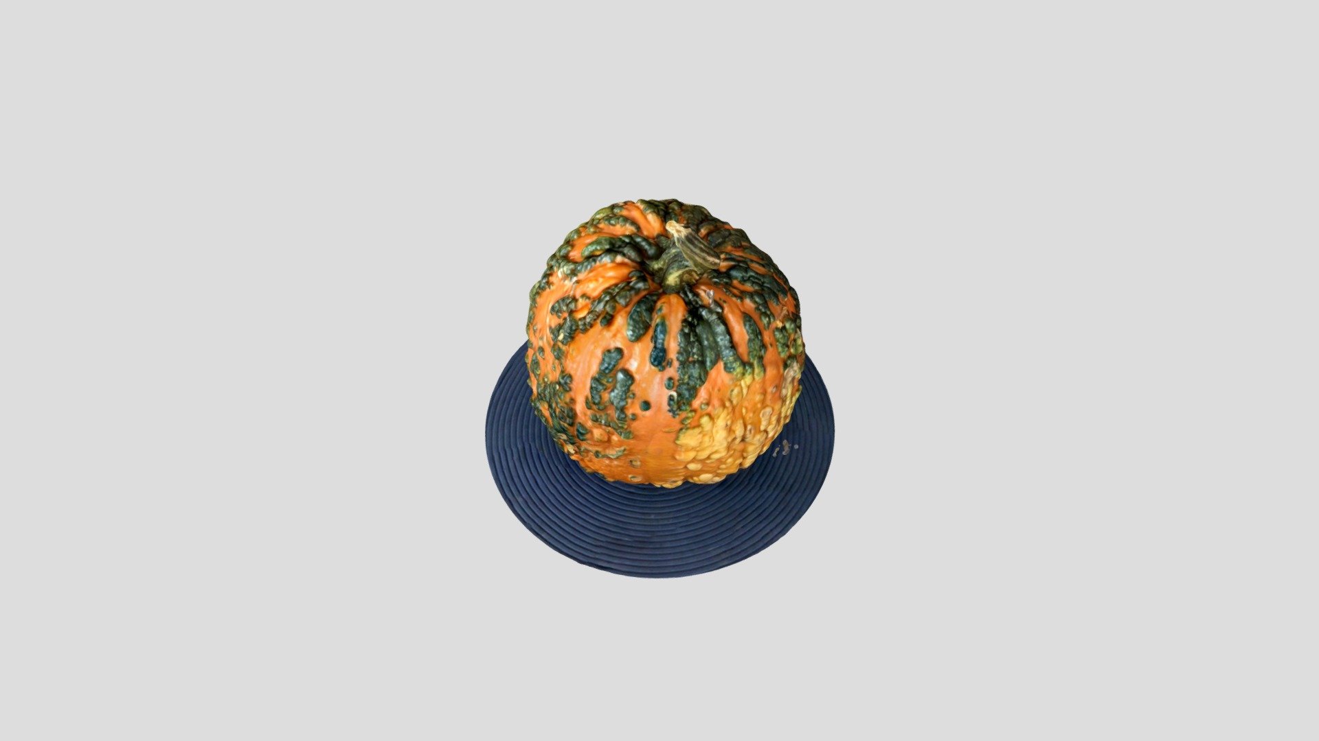 a orange and green pumpkin