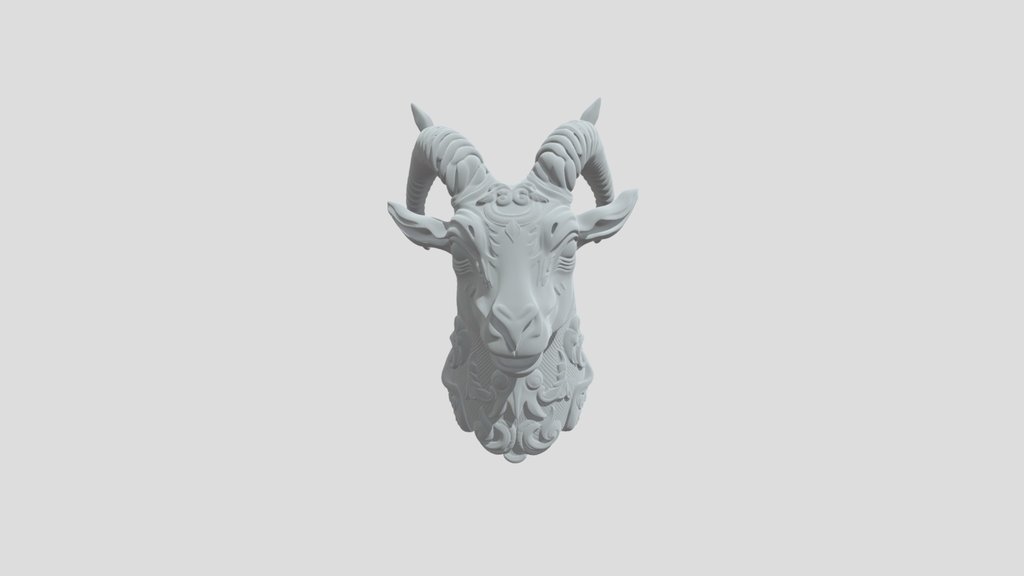 a metal statue of goat face