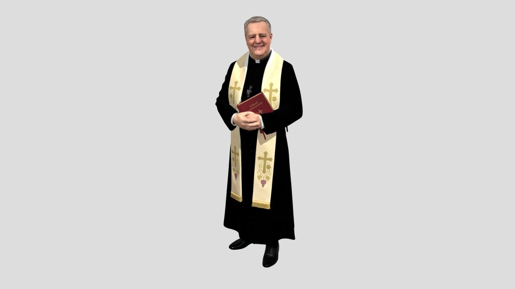 Priest in ceremonial vestments holding a Bible