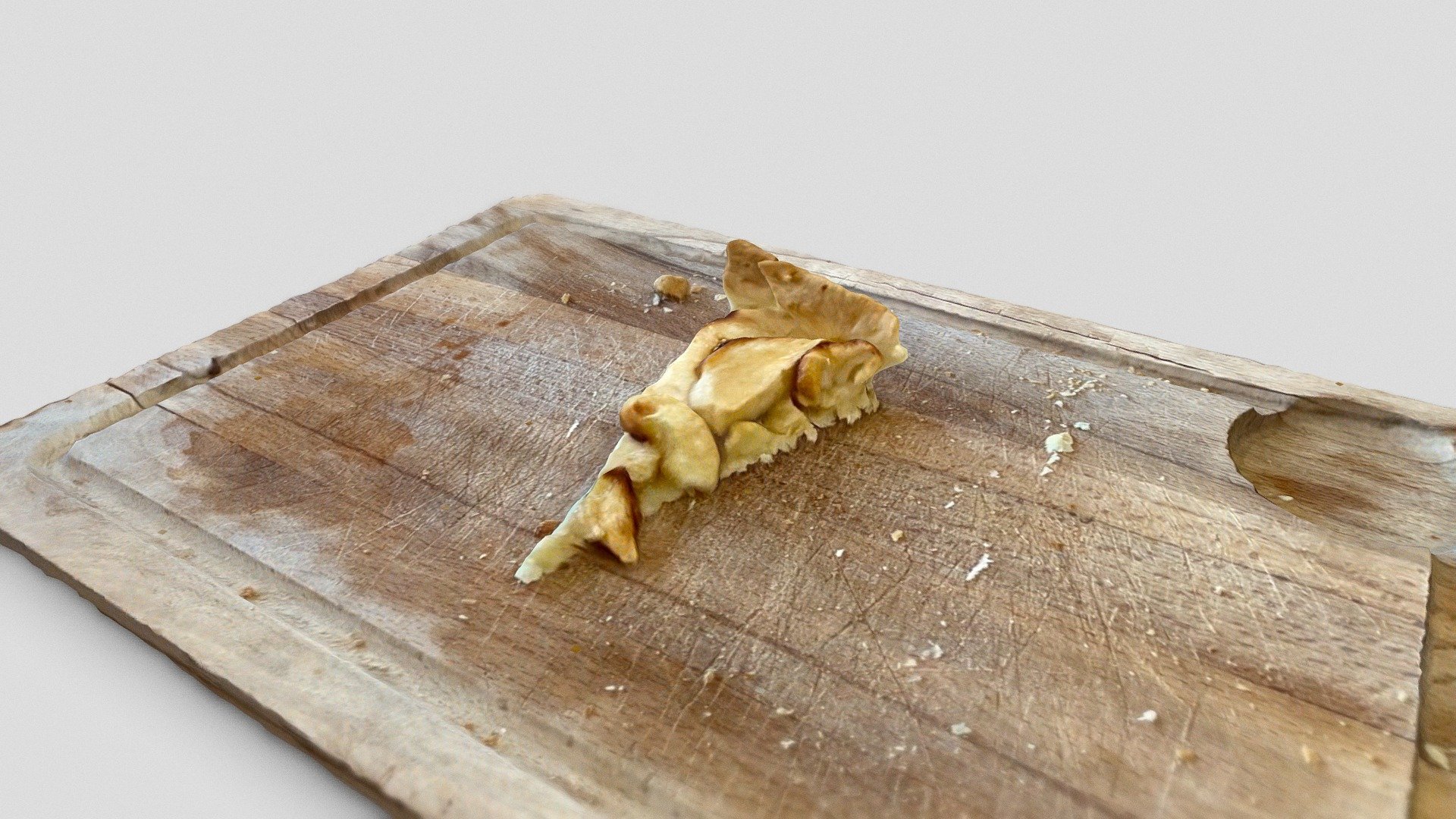 Slice of apple pie on wood board