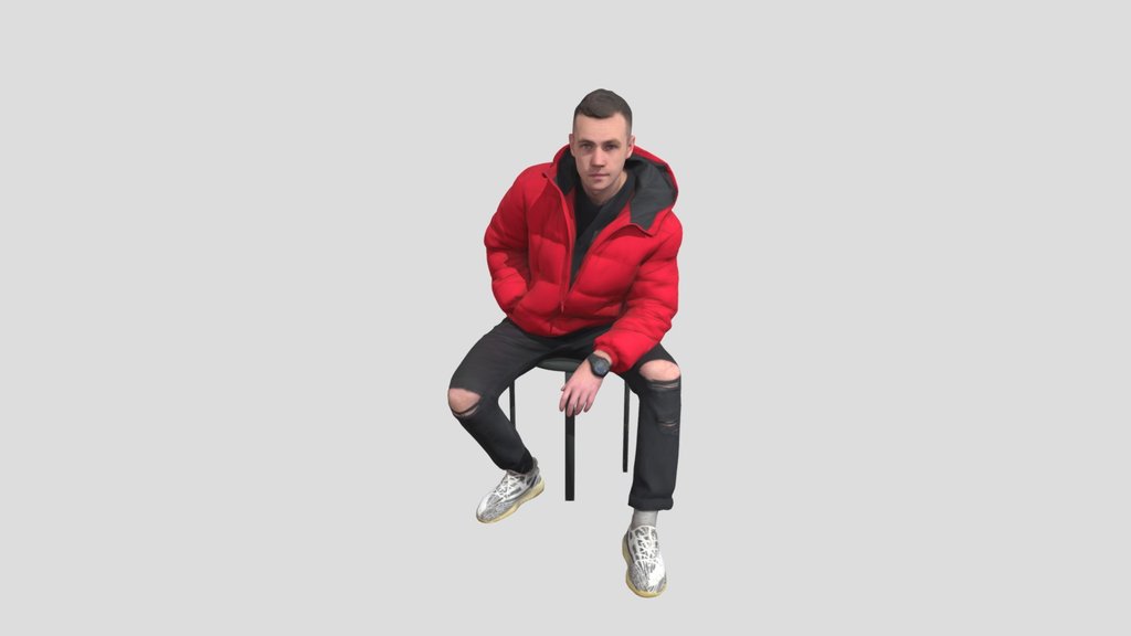 Guy In Jeans With Torn Knees Sitting
